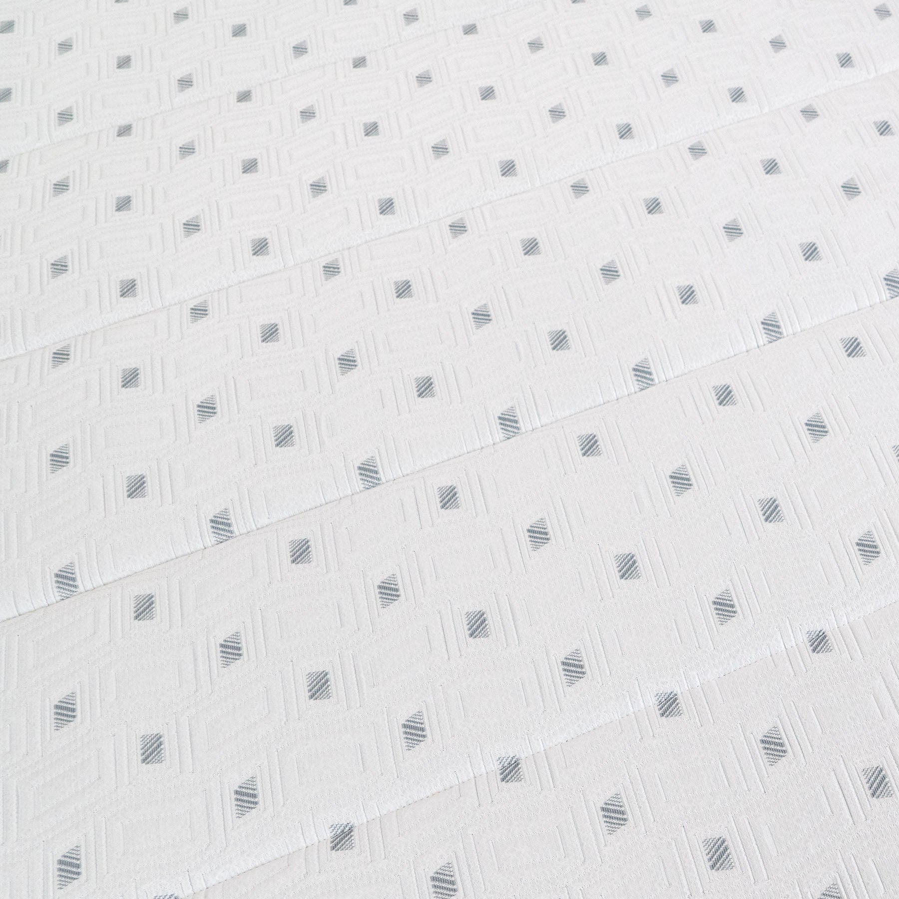 White fabric with a subtle geometric pattern